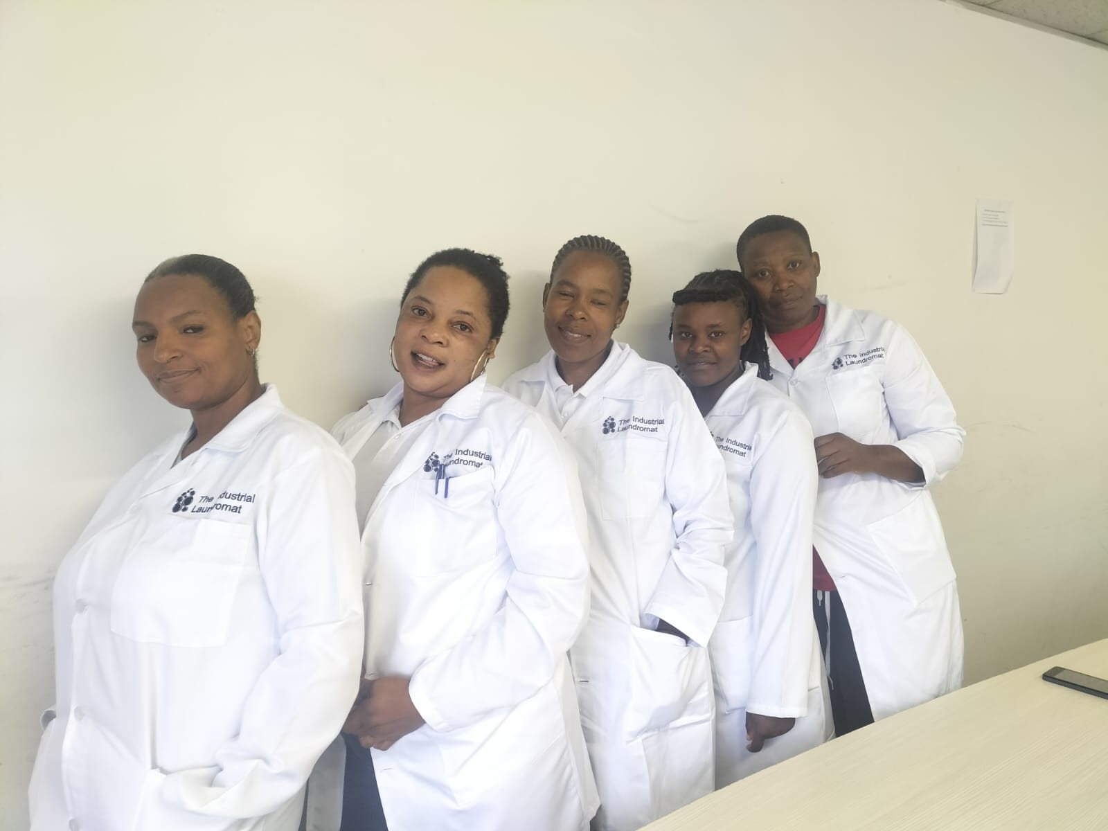 Industrial Laundromat team wearing branded garments